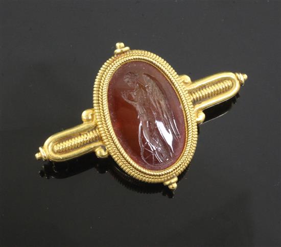 A Victorian Castellani gold and Roman carnelian intaglio archaeological revival style brooch, 49mm.